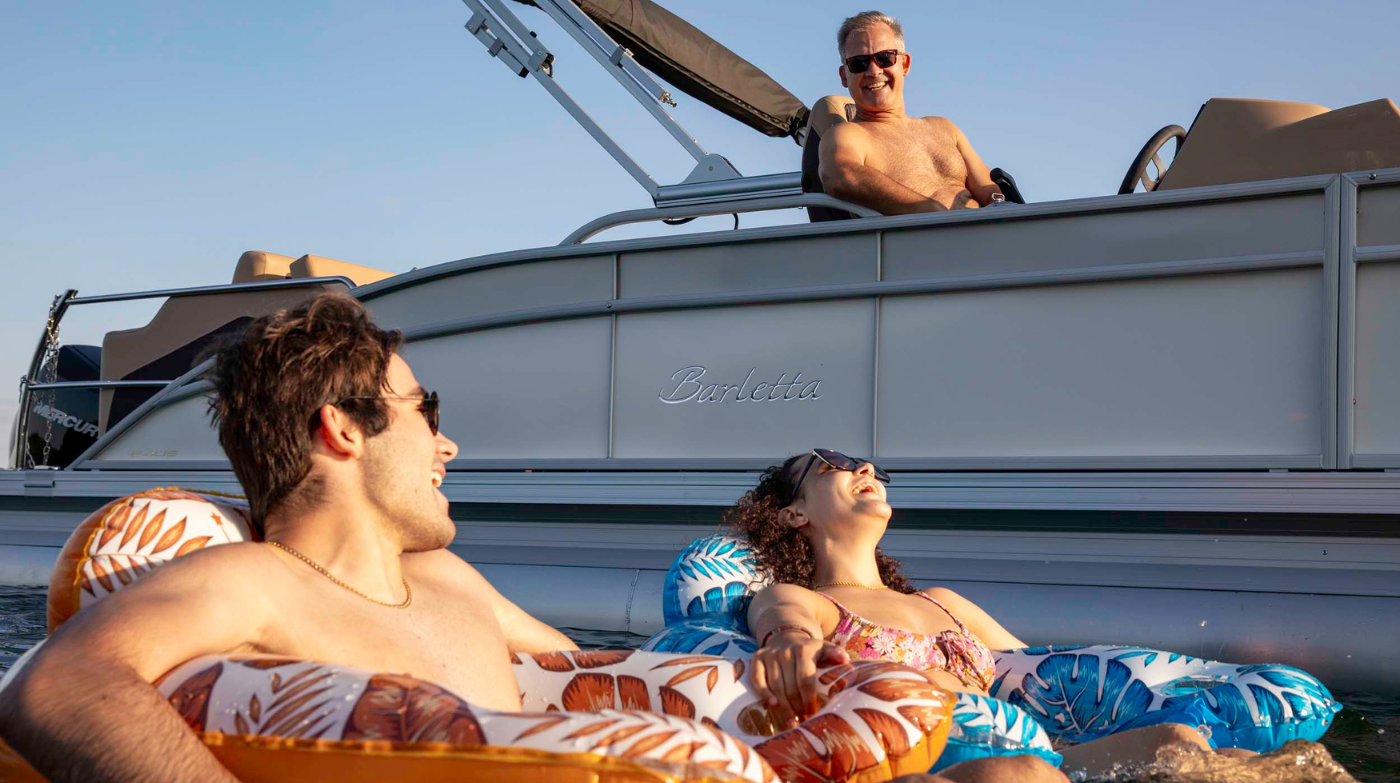 family enjoying pontoon boat