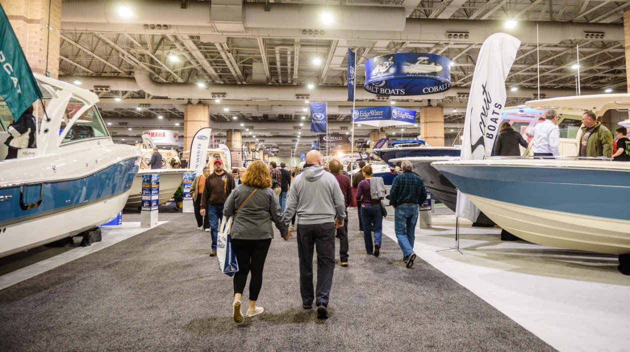 couple walking around boat show